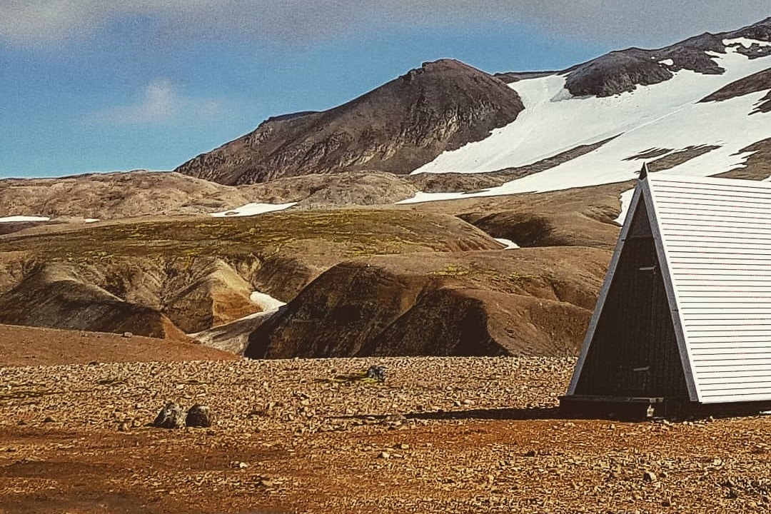 Hveradalir is a geothermal area that rises between red rhyolite mountains